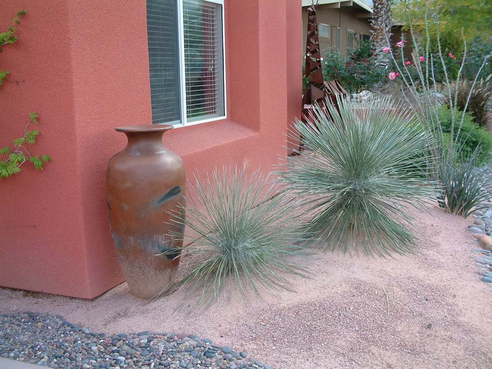 Urn in Front of Red House